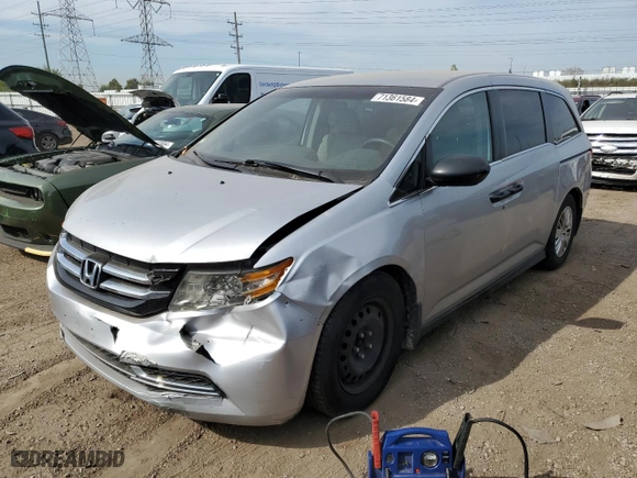 2014 Honda Odyssey LX with VIN 5FNRL5H2XEB135917, listed as a Copart auction lot 79043514 with 329,233 mi miles and Salvage Title. Bid and sale history available at carsss.com. Image 1.