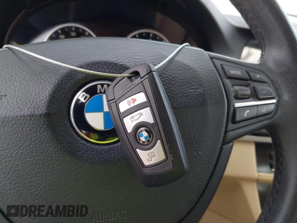 2013 BMW 5 Series 528i xDrive with VIN WBAXH5C54DD107317, listed as a IAAI auction lot 42244446 with 47,858 mi miles and . Bid and sale history available at DreamBid. Image 11.