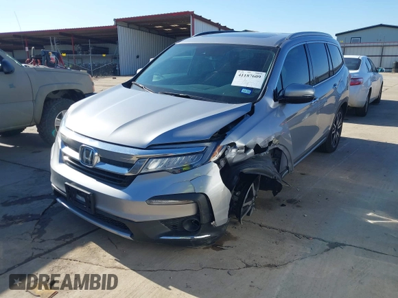 2020 Honda Pilot Touring 8-Passenger with VIN 5FNYF6H95LB021455, listed as a IAAI auction lot 41187609 with 35,589 mi miles and . Bid and sale history available at DreamBid. Image 17.