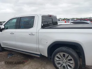2022 GMC Sierra 1500 Denali with VIN 3GTU9FELXNG127029, listed as a IAAI auction lot 42062882 with 24,082 mi miles and . Bid and sale history available at DreamBid. Image 14.