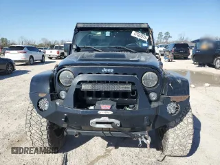 2015 Jeep Wrangler Unlimited Rubicon Hard Rock with VIN 1C4HJWFG1FL710264, listed as a Copart auction lot 47563975 with 96,737 mi miles and Salvage title. Bid and sale history available at DreamBid. Image 5.