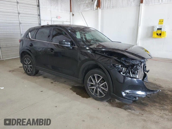 2018 Mazda CX-5 Grand Touring with VIN JM3KFBDM4J0412835, listed as a Copart auction lot 55441315 with 191,968 mi miles and Salvage title. Bid and sale history available at DreamBid. Image 4.