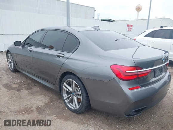 2016 BMW 7 Series 740i with VIN WBA7E2C56GG546920, listed as a IAAI auction lot 41610698 with 119,689 mi miles. Bid and sale history available at carsss.com. Image 3.
