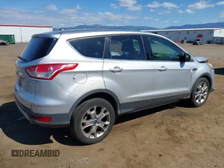 2013 Ford Escape SEL with VIN 1FMCU0H96DUA30733, listed as a IAAI auction lot 42737439 with 106,651 mi miles and . Bid and sale history available at DreamBid. Image 4.