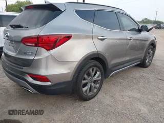 2018 Hyundai Santa Fe Ultimate with VIN 5NMZWDLAXJH100108, listed as a IAAI auction lot 42126768 with 68,325 mi miles and . Bid and sale history available at DreamBid. Image 4.