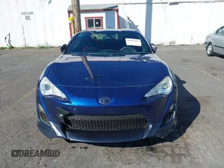 2013 Scion FR-S with VIN JF1ZNAA11D2702415, listed as a IAAI auction lot 40381041 with 63,581 mi miles. Bid and sale history available at carsss.com. Image 12.