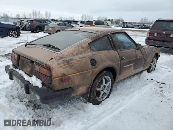 1979 Datsun 280ZX z VIN HS130137808, wystawiony jako Copart lot #43799165 z przebiegiem 28 995 mil mil oraz Tytuł czysty. Historia ofert i sprzedaży dostępna na DreamBid. Obrazek 3.