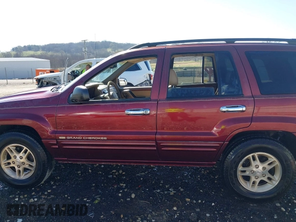 1999 Jeep Grand Cherokee Limited with VIN 1J4GW68N3XC770468, listed as a IAAI auction lot 41793600 with 65,277 mi miles. Bid and sale history available at carsss.com. Image 14.