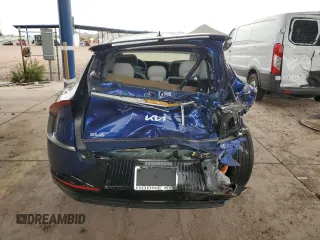 2023 Kia EV6 Wind with VIN KNDC34LA2P5606994, listed as a Copart auction lot 69288354 with 8,477 mi miles and Salvage Title. Bid and sale history available at carsss.com. Image 6.