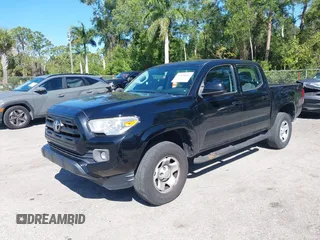 2016 Toyota Tacoma SR5 with VIN 5TFAX5GN1GX055850, listed as a IAAI auction lot 41828806 with 111,655 mi miles. Bid and sale history available at carsss.com. Image 2.