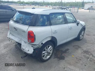 2014 MINI Countryman z VIN WMWZB3C50EWR37412, wystawiony jako IAAI lot #42330526 z przebiegiem 139 310 mil mil oraz . Historia ofert i sprzedaży dostępna na DreamBid. Obrazek 4.