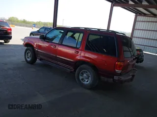 1999 Mercury Mountaineer z VIN 4M2DU55P5XUJ31186, wystawiony jako IAAI lot #42021103 z przebiegiem 141 887 mil mil oraz . Historia ofert i sprzedaży dostępna na DreamBid. Obrazek 3.