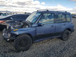 1995 Suzuki Sidekick JX z VIN 2S3TD03V5S6403069, wystawiony jako Copart lot #80273204 z przebiegiem Nie podano mil oraz Szkody całkowita. Historia ofert i sprzedaży dostępna na DreamBid. Obrazek 1.