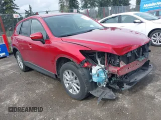 2016 Mazda CX-5 Touring z VIN JM3KE2CY1G0763069, wystawiony jako IAAI lot #41906048 z przebiegiem 71 605 mil mil oraz . Historia ofert i sprzedaży dostępna na DreamBid. Obrazek 1.