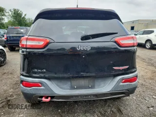 2014 Jeep Cherokee Trailhawk with VIN 1C4PJMBS3EW127928, listed as a Copart auction lot 63825865 with 172,712 mi miles and Salvage title. Bid and sale history available at DreamBid. Image 6.