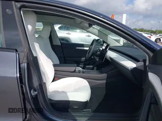 2023 Tesla Model 3 with VIN 5YJ3E1EA7PF567906, listed as a IAAI auction lot 42280993 with 41,452 mi miles and . Bid and sale history available at DreamBid. Image 5.