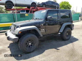 2009 Jeep Wrangler X with VIN 1J4FA24179L716499, listed as a Copart auction lot 58342675 with 116,871 mi miles and Salvage title. Bid and sale history available at DreamBid. Image 1.