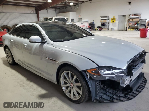 2016 Jaguar XJ R-Sport with VIN SAJWJ1CDXG8W00145, listed as a Copart auction lot 49901234 with 76,629 mi miles and . Bid and sale history available at DreamBid. Image 4.