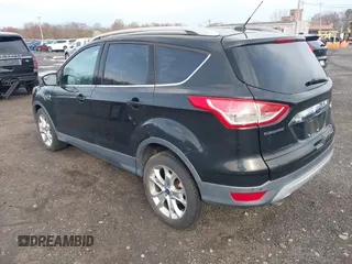 2014 Ford Escape Titanium with VIN 1FMCU9J98EUD73818, listed as a IAAI auction lot 42036442 with 129,794 mi miles. Bid and sale history available at carsss.com. Image 3.