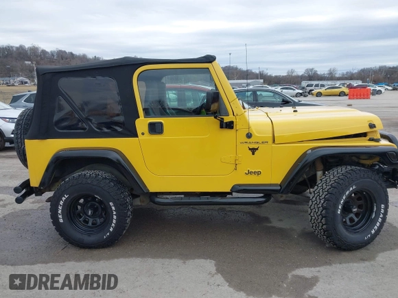 2000 Jeep Wrangler SE with VIN 1J4FA29P2YP797156, listed as a IAAI auction lot 41517183 with 114,236 mi miles. Bid and sale history available at carsss.com. Image 13.