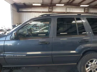 2003 Jeep Grand Cherokee Laredo with VIN 1J4GW48S33C539977, listed as a IAAI auction lot 42027703 with 100,534 mi miles. Bid and sale history available at carsss.com. Image 15.