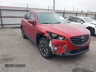 2016 Mazda CX-5 Grand Touring with VIN JM3KE2DY8G0871574, listed as a IAAI auction lot 41959686 with 95,416 mi miles and . Bid and sale history available at DreamBid. Image 1.