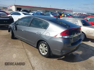 2013 Honda Insight EX with VIN JHMZE2H74DS002123, listed as a IAAI auction lot 42204860 with 279,376 mi miles and . Bid and sale history available at DreamBid. Image 3.