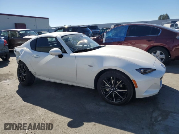 2024 Mazda MX-5 Miata Grand Touring z VIN JM1NDAM76R0602972, wystawiony jako Copart lot #77665904 z przebiegiem 4 965 mil mil oraz Szkoda całkowita • Salvage title. Historia ofert i sprzedaży dostępna na DreamBid. Obrazek 4.