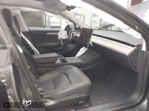 2023 Tesla Model 3 with VIN 5YJ3E1EAXPF669538, listed as a IAAI auction lot 40329679 with 16,612 mi miles and . Bid and sale history available at DreamBid. Image 5.