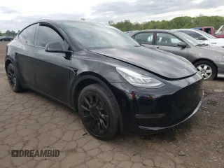 2022 Tesla Model Y Long Range z VIN 7SAYGDEEXNA008898, wystawiony jako Copart lot #54915445 z przebiegiem 35 467 mil mil oraz Szkoda całkowita • Salvage title. Historia ofert i sprzedaży dostępna na DreamBid. Obrazek 4.