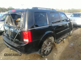 2012 Honda Pilot Touring with VIN 5FNYF3H90CB035309, listed as a IAAI auction lot 41063215 with 228,081 mi miles and . Bid and sale history available at carsss.com. Image 4.