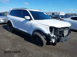 2022 Kia Telluride SX z VIN 5XYP5DHC2NG299501, wystawiony jako IAAI lot #41816830 z przebiegiem 61 413 mil mil oraz . Historia ofert i sprzedaży dostępna na DreamBid. Obrazek 1.