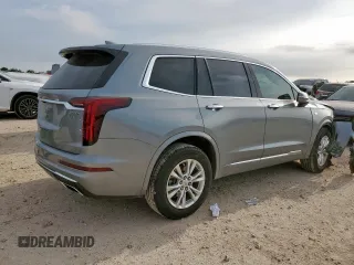 2024 Cadillac XT6 FWD Luxury with VIN 1GYKPAR41RZ700452, listed as a Copart auction lot 57675945 with 27,449 mi miles and Salvage title. Bid and sale history available at DreamBid. Image 3.