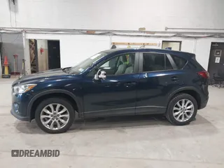 2015 Mazda CX-5 Grand Touring z VIN JM3KE4DYXF0490920, wystawiony jako IAAI lot #42367194 z przebiegiem 80 436 mil mil oraz . Historia ofert i sprzedaży dostępna na DreamBid. Obrazek 14.