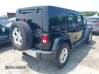 2014 Jeep Wrangler Unlimited Sahara with VIN 1C4BJWEG0EL273086, listed as a IAAI auction lot 42340938 with 121,448 mi miles and . Bid and sale history available at DreamBid. Image 4.