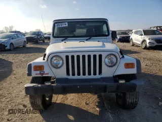 2004 Jeep Wrangler Sport Right Hand Drive with VIN 1J4F449S54P775671, listed as a Copart auction lot 85610114 with 199,074 mi miles and Salvage Title. Bid and sale history available at carsss.com. Image 5.