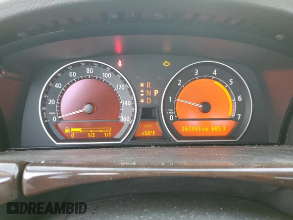 2006 BMW 7 Series 750i with VIN WBAHL83506DT05674, listed as a Copart auction lot 77176834 with 263,495 mi miles and Salvage title. Bid and sale history available at DreamBid. Image 9.