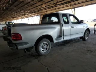 2003 Ford F-150 XL with VIN 1FTRX07233KD43811, listed as a Copart auction lot 85113414 with 215,390 mi miles and Salvage Title. Bid and sale history available at carsss.com. Image 3.