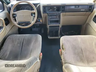 1993 Dodge Caravan Grand SE z VIN 1B4GH44R0PX686790, wystawiony jako Copart lot #83757254 z przebiegiem 287 137 mil mil oraz Szkody całkowita. Historia ofert i sprzedaży dostępna na DreamBid. Obrazek 8.
