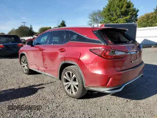 2021 Lexus RX with VIN JTJHZKFA0M2028764, listed as a Copart auction lot 75574134 with 34,988 mi miles and Salvage Title. Bid and sale history available at carsss.com. Image 2.