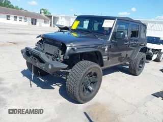 2014 Jeep Wrangler Unlimited Sport with VIN 1C4BJWDG4EL295044, listed as a IAAI auction lot 41997837 with 143,447 mi miles. Bid and sale history available at carsss.com. Image 2.