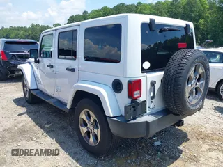 2018 Jeep Wrangler Unlimited Sahara with VIN 1C4BJWEG3JL805263, listed as a IAAI auction lot 42593276 with 96,489 mi miles and . Bid and sale history available at DreamBid. Image 3.