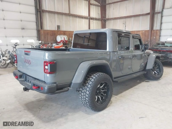 2020 Jeep Gladiator Rubicon with VIN 1C6JJTBG1LL214681, listed as a IAAI auction lot 41979666 with 23,811 mi miles. Bid and sale history available at carsss.com. Image 4.