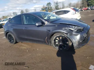 2023 Tesla Model Y Long Range z VIN 7SAYGAEE3PF596826, wystawiony jako Copart lot #50513045 z przebiegiem 30 747 mil mil oraz Szkoda całkowita • Salvage title. Historia ofert i sprzedaży dostępna na DreamBid. Obrazek 4.