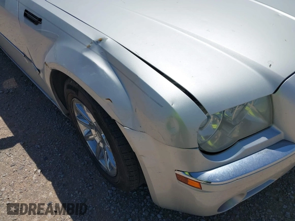 2006 Chrysler 300 C with VIN 2C3KA63H46H154990, listed as a IAAI auction lot 42004790 with 233,673 mi miles. Bid and sale history available at carsss.com. Image 6.