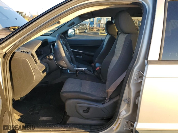 2009 Jeep Grand Cherokee Laredo with VIN 1J8GR48K89C551203, listed as a Copart auction lot 49252125 with 122,071 mi miles and Salvage Title. Bid and sale history available at carsss.com. Image 7.