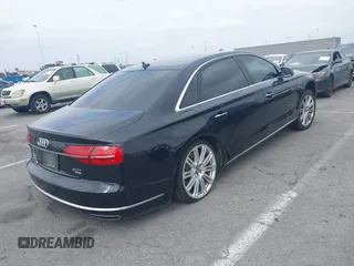 2015 Audi A8 L 4.0T with VIN WAU32AFD4FN033471, listed as a IAAI auction lot 42120112 with 174,882 mi miles. Bid and sale history available at carsss.com. Image 4.