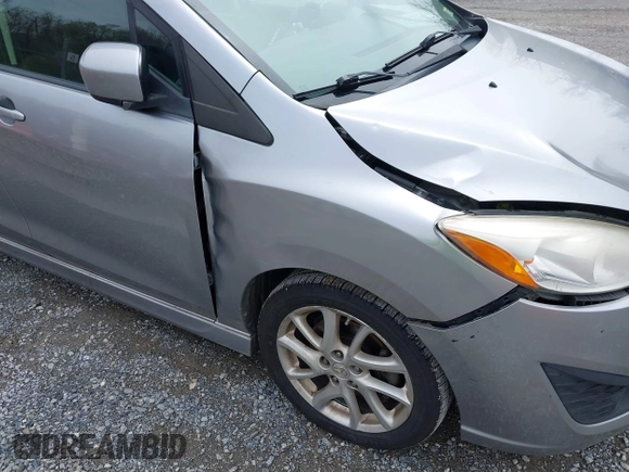 2012 Mazda 5 Touring with VIN JM1CW2CLXC0100740, listed as a IAAI auction lot 41918794 with 234,102 mi miles and . Bid and sale history available at DreamBid. Image 13.