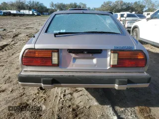 1983 Datsun 280ZX z VIN JN1HZ04S0DX560086, wystawiony jako Copart lot #79178604 z przebiegiem 183 309 mil mil oraz Szkody całkowita. Historia ofert i sprzedaży dostępna na DreamBid. Obrazek 6.