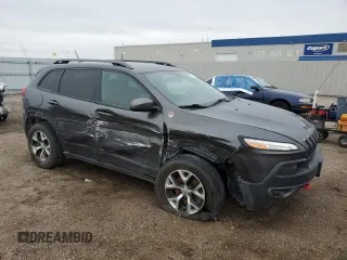 2015 Jeep Cherokee Trailhawk with VIN 1C4PJMBB6FW574108, listed as a Copart auction lot 57798475 with 105,022 mi miles and Salvage title. Bid and sale history available at DreamBid. Image 4.